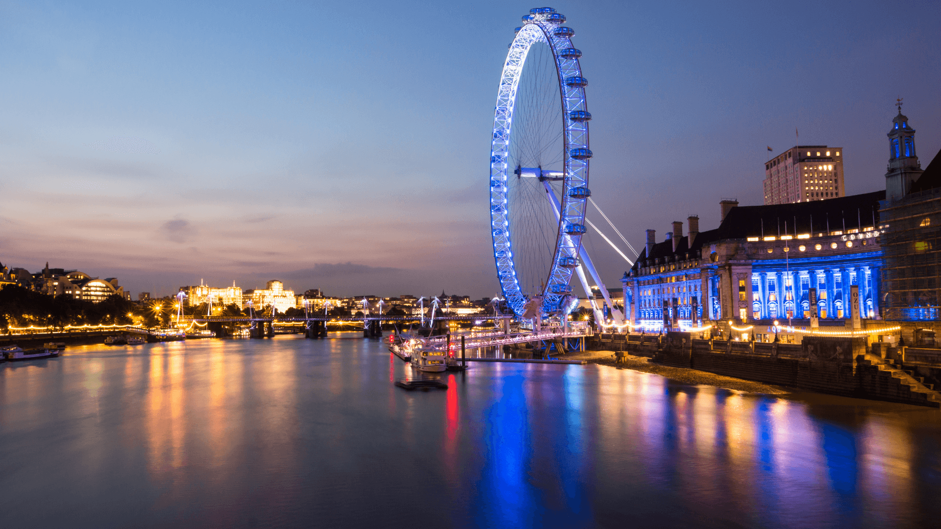 Photograph of the London Eye at night.